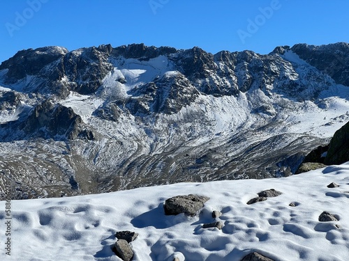 The melting of fresh autumn snow in the wonderful environment of the Swiss mountain massif Abula Alps, Zernez - Canton of Grisons, Switzerland (Kanton Graubünden, Schweiz) photo
