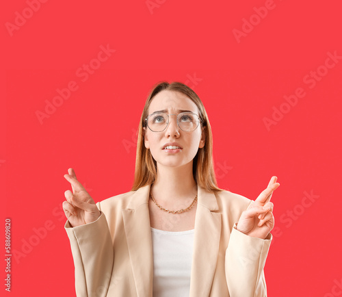 Worried young businesswoman...