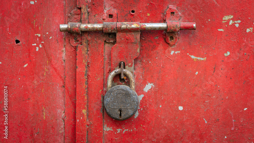 Wallpaper Mural Rusted lock on a red iron door depicting solitude, old, pass of time Torontodigital.ca