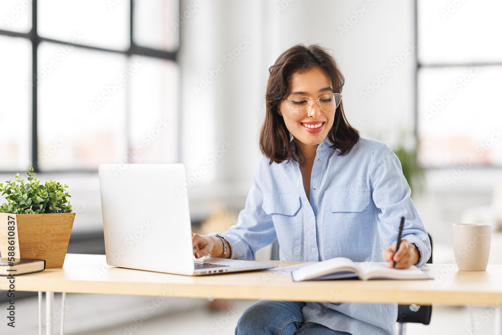 beautiful young smiling woman working remotely behind laptop at home beautiful young smiling woman working remotely behind laptop at home