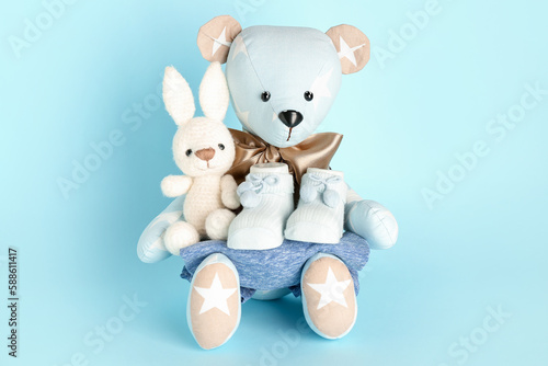 Toy bear and bunny with bab...