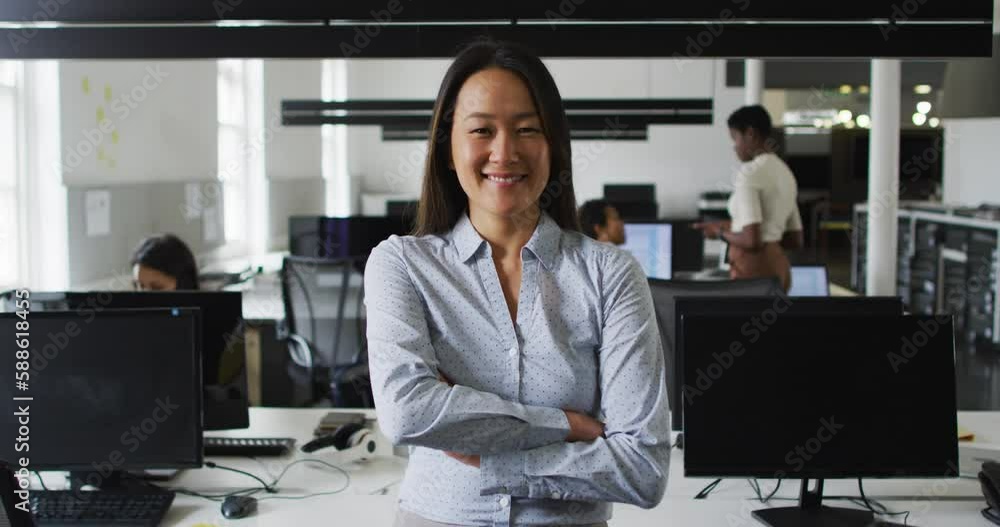 Portrait of asian businesswoman smiling and standing in office Portrait of asian businesswoman smiling and standing in office