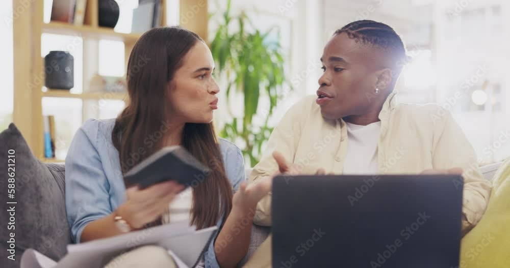 Conflict, argument and couple with calculator for debt, taxes or expenses on sofa in home. Interracial, fighting and black man and angry woman with financial stress, bankruptcy problem or bills. Conflict, argument and couple with calculator for debt, taxes or expenses on sofa in home. Interracial, fighting and black man and angry woman with financial stress, bankruptcy problem or bills.