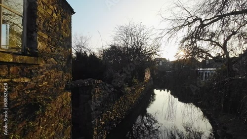 Video footage of the river eea running through the Cumbrian Village of Cartmel in the English Lake District. Showing a peaceful sunset scene photo