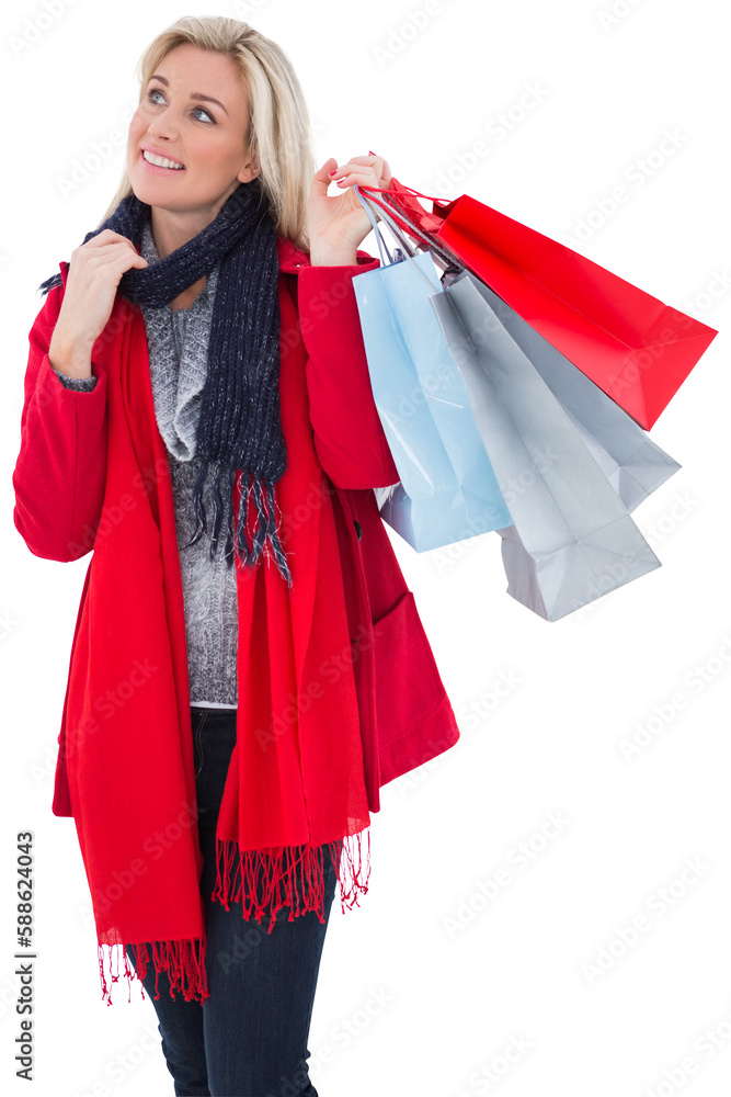 Blonde in winter clothes holding shopping bags Blonde in winter clothes holding shopping bags