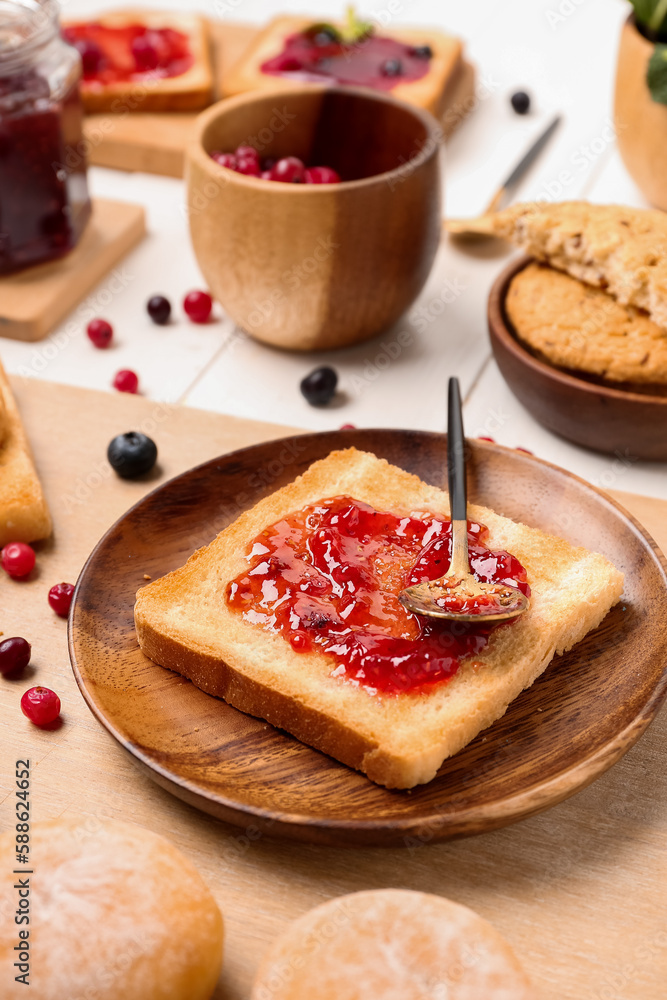Plate of tasty toast with jam on table Plate of tasty toast with jam on table