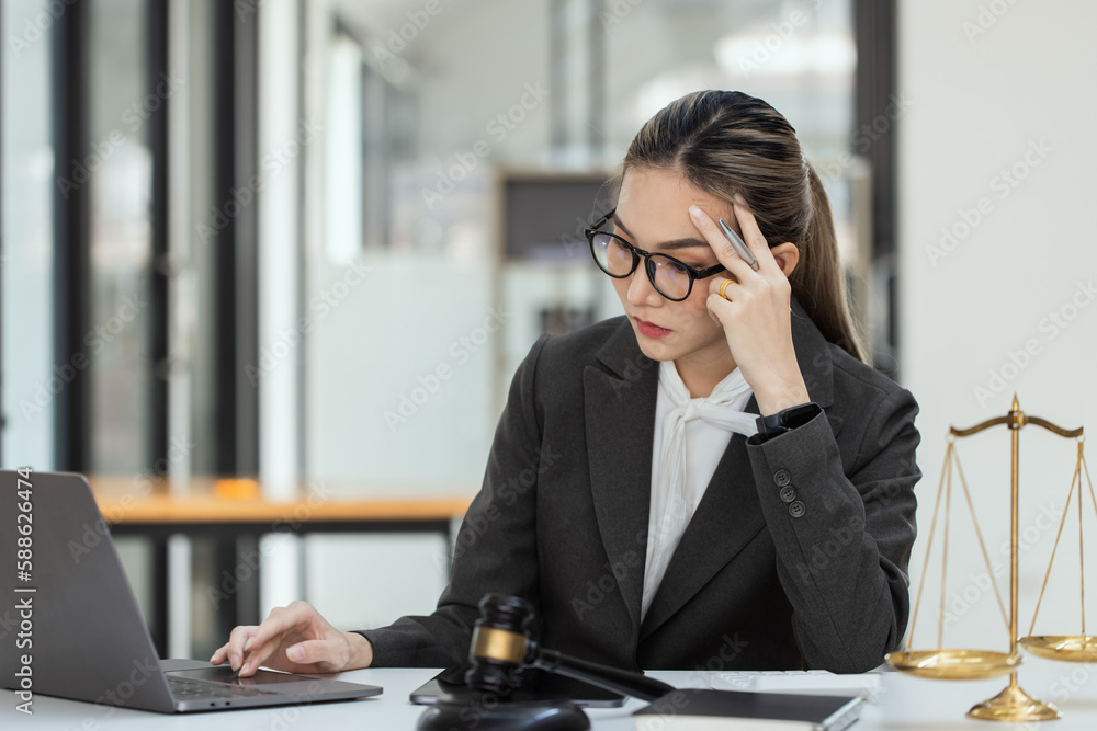 Asian lawyer woman working at law office desk, law firms, advice and justice concept. Asian lawyer woman working at law office desk, law firms, advice and justice concept.