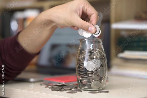 Put coins in glass bottles to save money