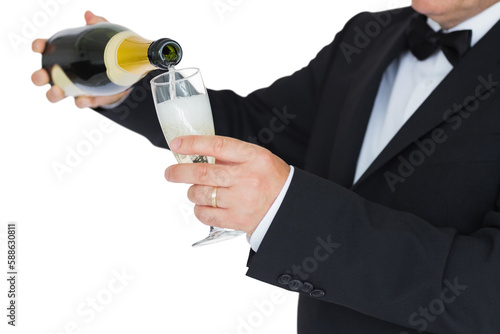 Man in suit pouring champagne