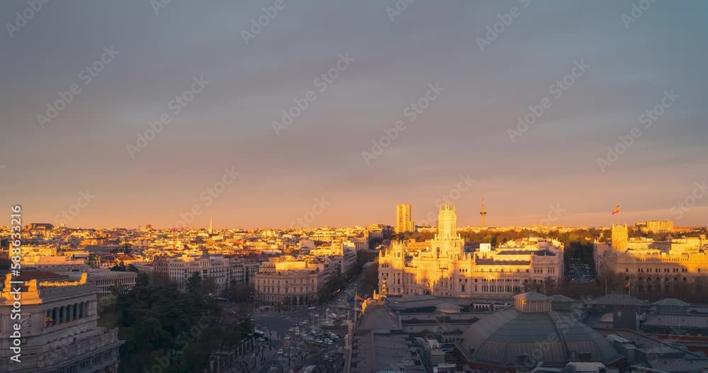 Timelapse Madrid aerial view of Cibeles town hall and retiro park during colorful sunset with beautiful clouds Timelapse Madrid aerial view of Cibeles town hall and retiro park during colorful sunset with beautiful clouds