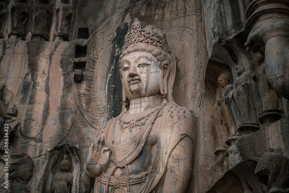 Famous Longmen Grottoes (statues of Buddha and Bodhisattvas carved in the monolith rock near Luoyang in Hennn province, China), UNESCO WORLD HERITAGE site