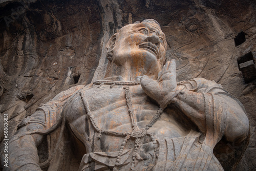 Longmen Grottoes with Buddha's figures are Starting with the Northern Wei Dynasty in 493 AD. It is one of the four notable grottoes in China. photo