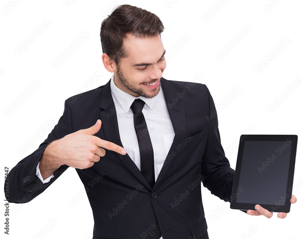 Happy businessman pointing with his tablet Happy businessman pointing with his tablet