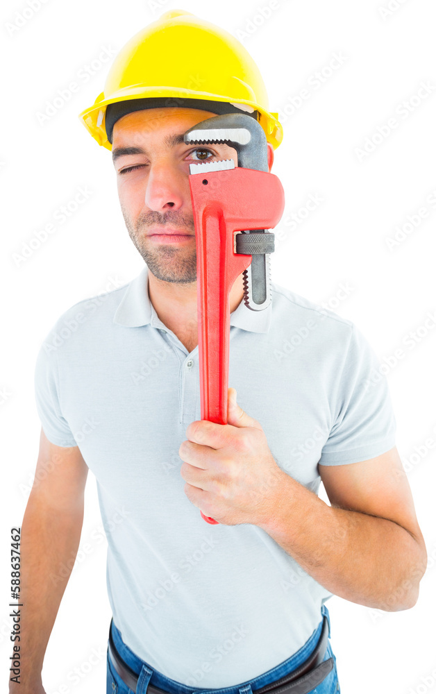 Fototapeta premium Manual worker looking through monkey wrench