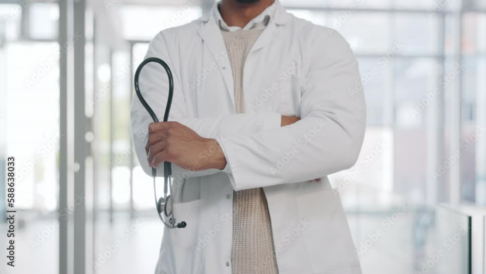 Doctor, man and arms crossed, confidence and pride with healthcare and surgeon in hospital with stethoscope. Male physician, cardiovascular health and medical professional with expert in medicine Doctor, man and arms crossed, confidence and pride with healthcare and surgeon in hospital with stethoscope. Male physician, cardiovascular health and medical professional with expert in medicine