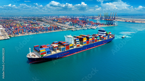 Aerial view of cargo ship carrying container running for export import near cargo yard port concept freight shipping.