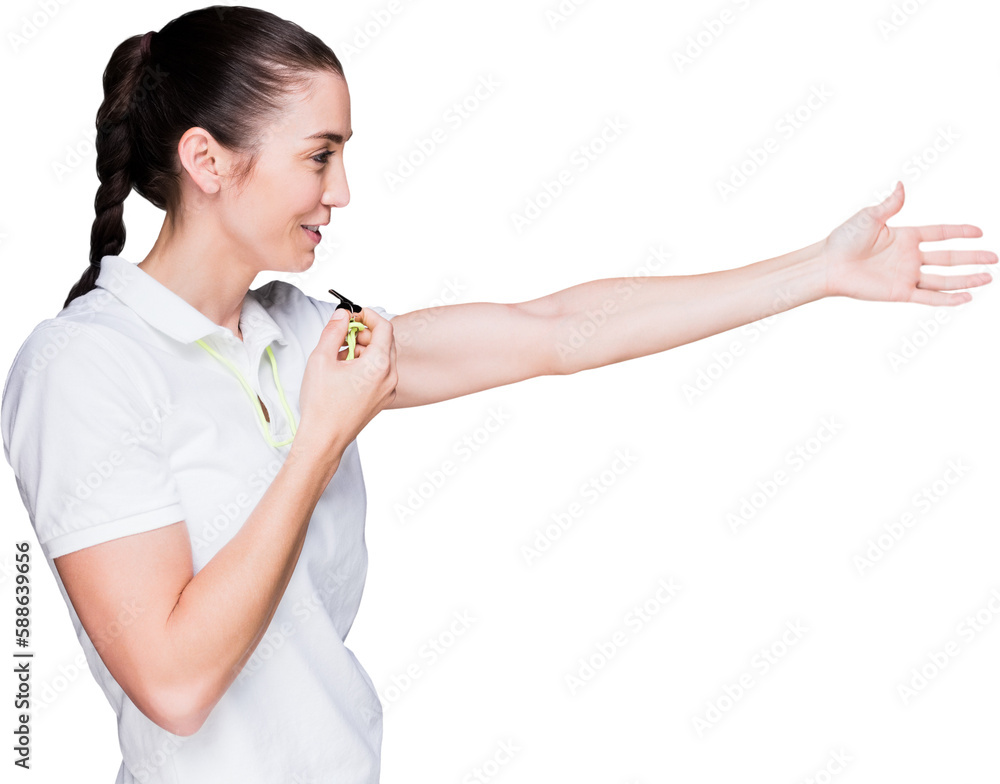 Female athlete blowing a whistle and pointing Female athlete blowing a whistle and pointing