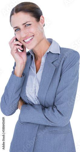 Portrait of smiling businesswoman discussing on mobile phone