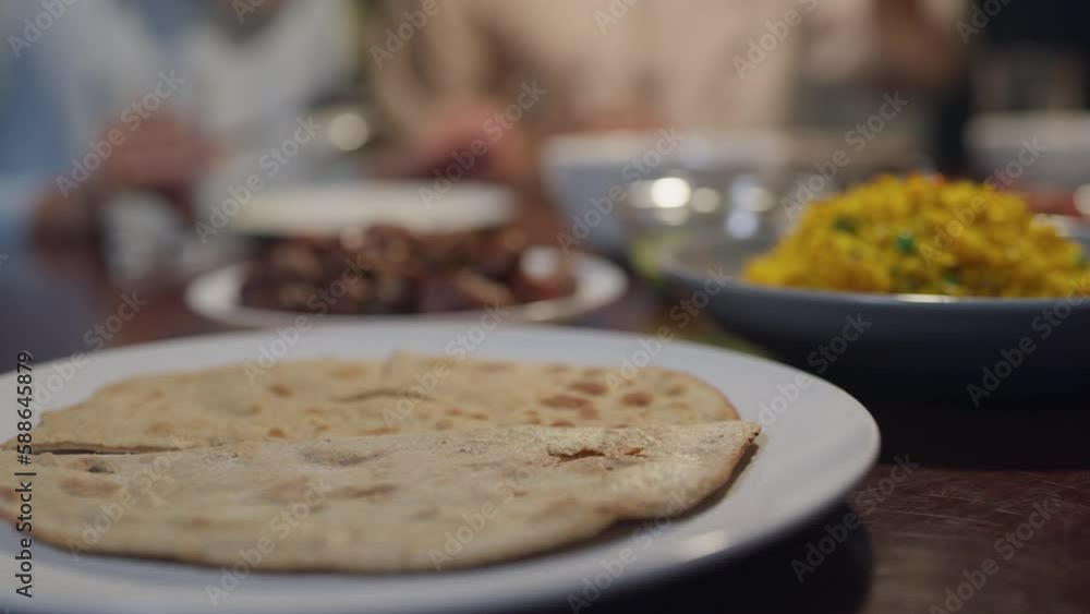Closeup bread dish Islam woman grab naan bread for break feast. Eid