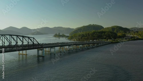 Wallpaper Mural Moving aerial side view of the busy traffic on two seperate bridges in the afternoon sunshine. Torontodigital.ca