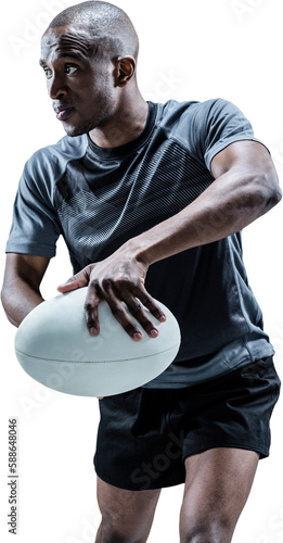 Determined rugby player in position to throw ball