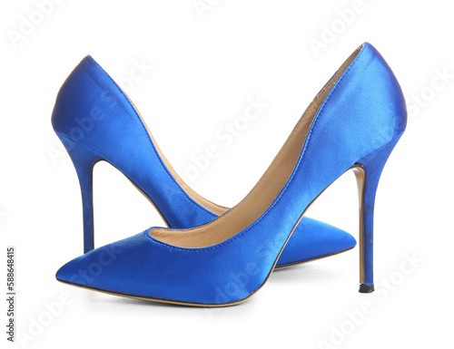 Pair of blue high heeled shoes on white background