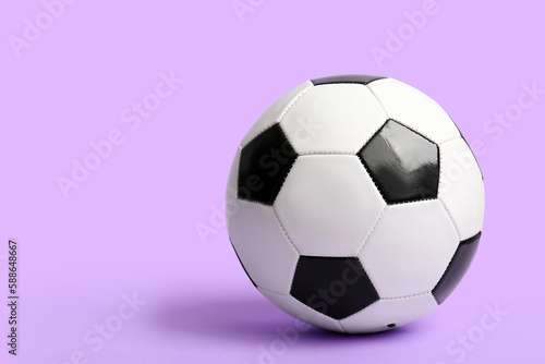 Soccer ball on lilac background