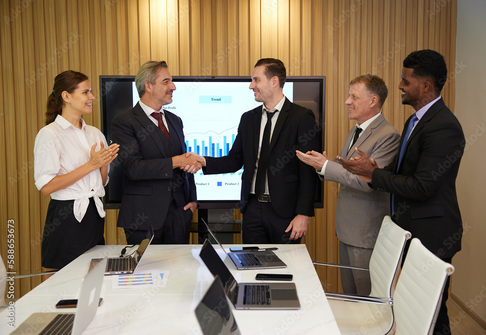 businesspeople shaking hands from success at work or project in conference room businesspeople shaking hands from success at work or project in conference room