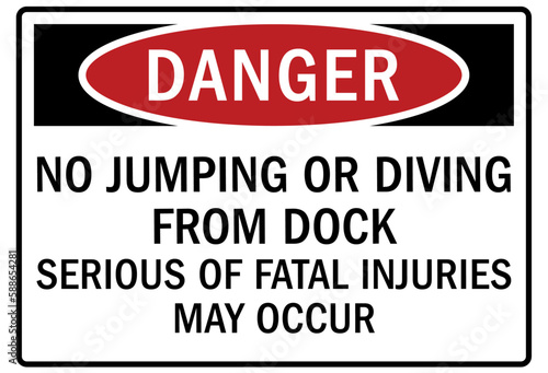 Dock sign and labels no jumping or diving from dock. Serious of fatal injuries may occur