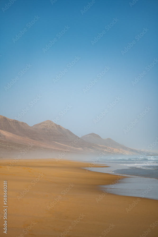 Stunning view of Cofete beach surrounded by the chain of mountains of the Jandía Natural Park. Fuerteventura, Canary Islands.