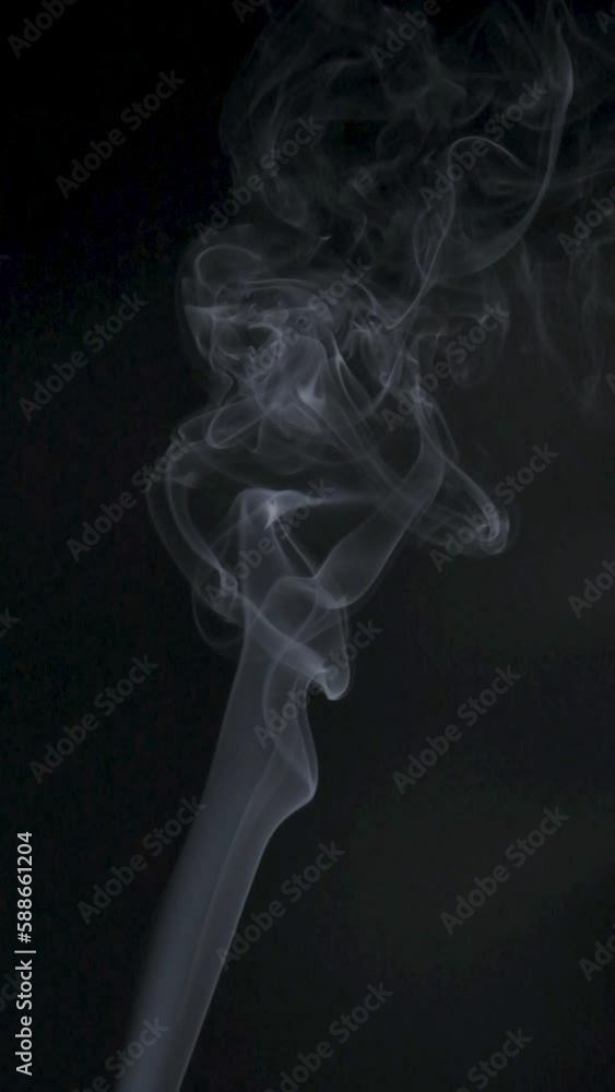 Slow motion vertical video of white smoke, fog, mist, vapor on a black background. Slow motion vertical video of white smoke, fog, mist, vapor on a black background.