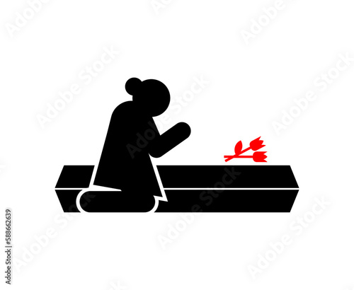 Widow at coffin. concept of sorrow and suffering