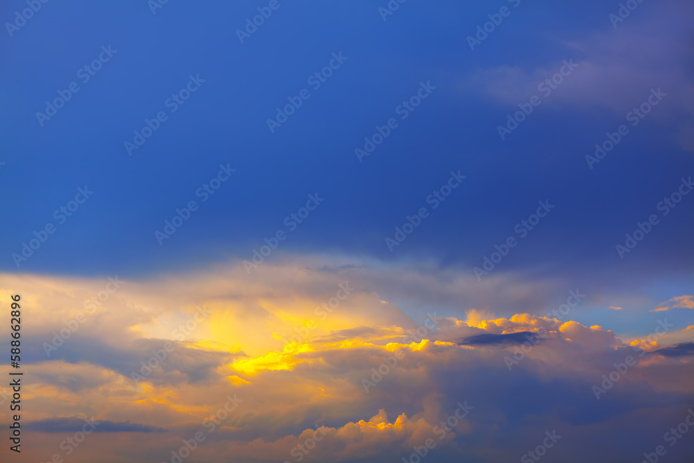 Illuminated clouds with twilight . Evening sky background Illuminated clouds with twilight . Evening sky background