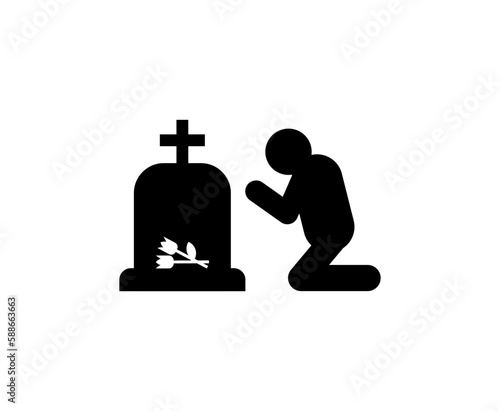 Widower at his wife's grave. concept of sorrow and suffering