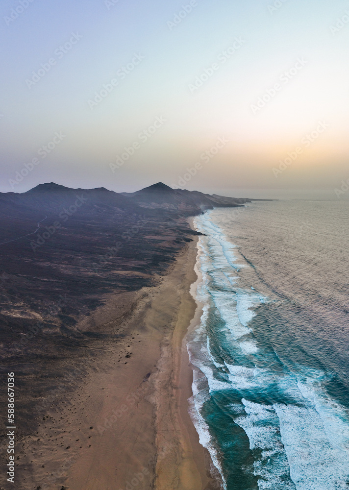 View from above, stunning panoramic view of Cofete beach surrounded by the chain of mountains of the Jandía Natural Park. Fuerteventura, Canary Islands.