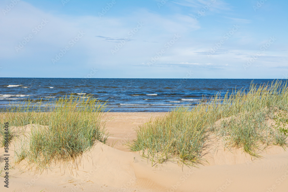 Fototapeta premium View of the sand dunes and Gulf of Bothnia on the background, Marjaniemi, Hailuoto, Finland
