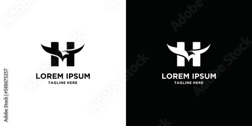 H letter with eagle logo. Eagle head silhouette and eagle wings negative space