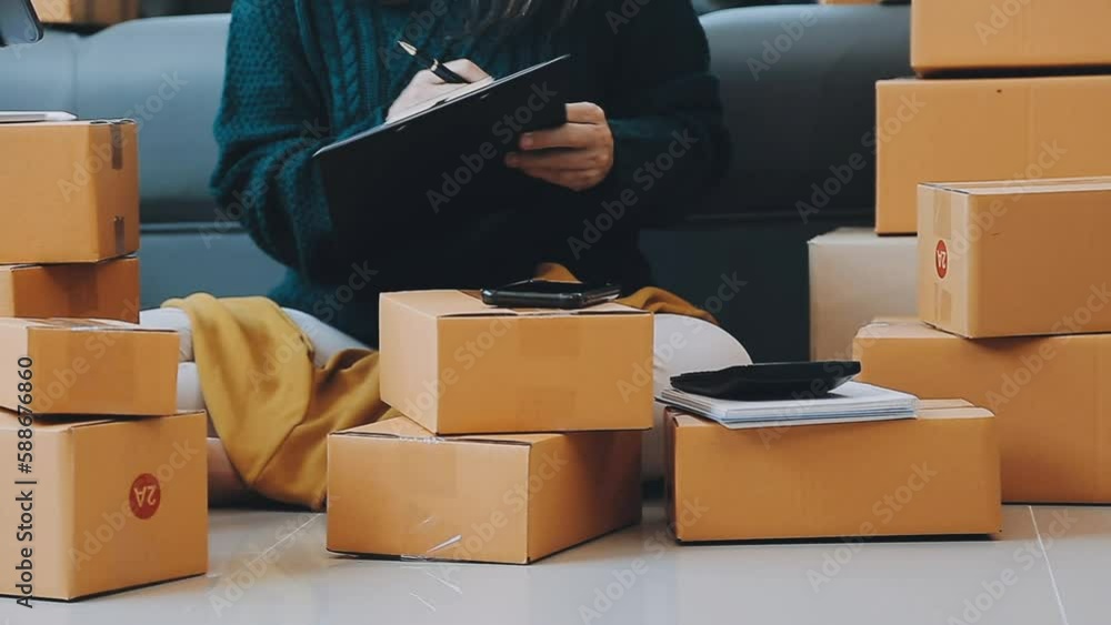 Business woman start up small business entrepreneur SME success .freelance woman working at home with Online Parcel delivery. SME and packaging deliveryconcept Business woman start up small business entrepreneur SME success .freelance woman working at home with Online Parcel delivery. SME and packaging deliveryconcept