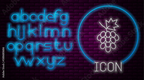 Glowing neon line Grape fruit icon isolated on brick wall background. Neon light alphabet. Vector