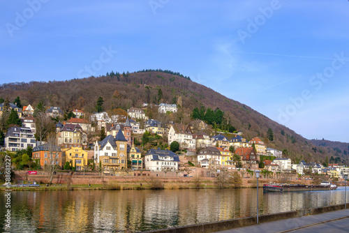 The barge MINERVA, sailing down the Neckar river and transporting scrap metal, passes the Old Town of Heidelberg, Baden-Württemberg, Germany, Europe, February 22, 2023. photo