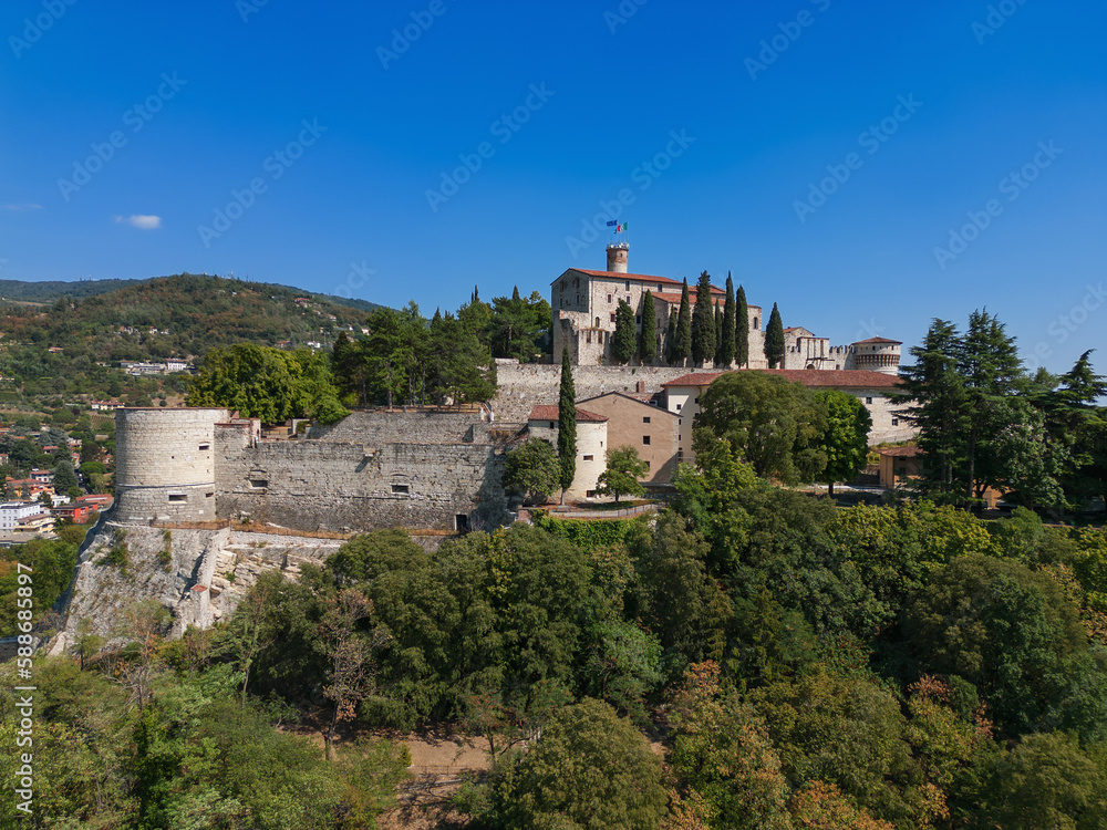 Beautiful view of the old park and the hill (colle Cidneo) with the historic castle on it in Brescia town. Lombardy, Italy