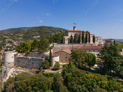 Panoramic drone view of the western part of the historic castle on a hill (colle Cidneo) in the city of Brescia. Lombardy, Italy photo