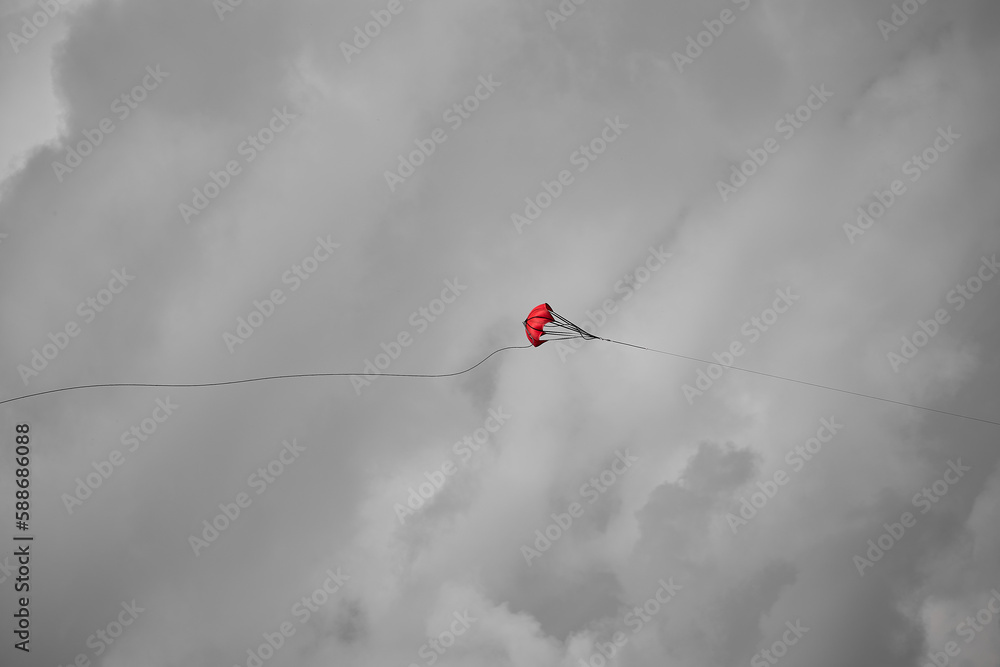 A Parachute for a glider tow rope in the middle of the cloudy sky. A Parachute for a glider tow rope in the middle of the cloudy sky.