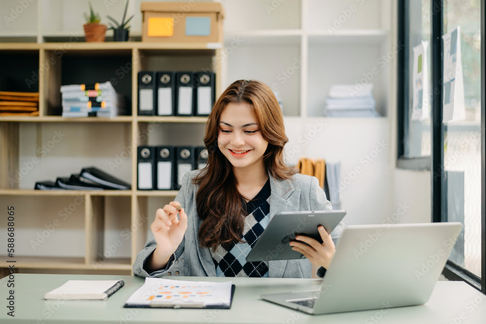 Woman freelancer is working her job on computer tablet and laptop Doing accounting analysis report real estate investment data, Financial Woman freelancer is working her job on computer tablet and laptop Doing accounting analysis report real estate investment data, Financial