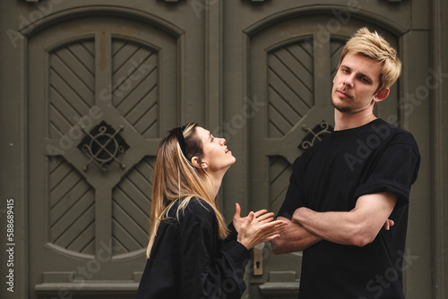Принти на полотні Frustrated wife asking forgiveness, making peace with offended husband after quarrel or cheating, sad man ignoring woman, not talking, family crisis, relationship problem, break up and divorce