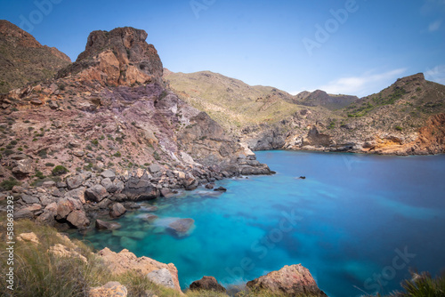 Mountainous environment with cove of blue waters in the background of the coast of Cartagena  Spain  Region of Murcia