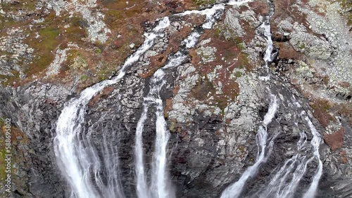 Aerial view of natural scenery of Hydnefossen waterfall falling from rocky cliffs in Hemsedal Norway photo