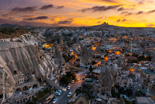 View of Goreme village with Uchisar castle in the background at sunset. Cappadocia. Nevsehir Province. Turkey