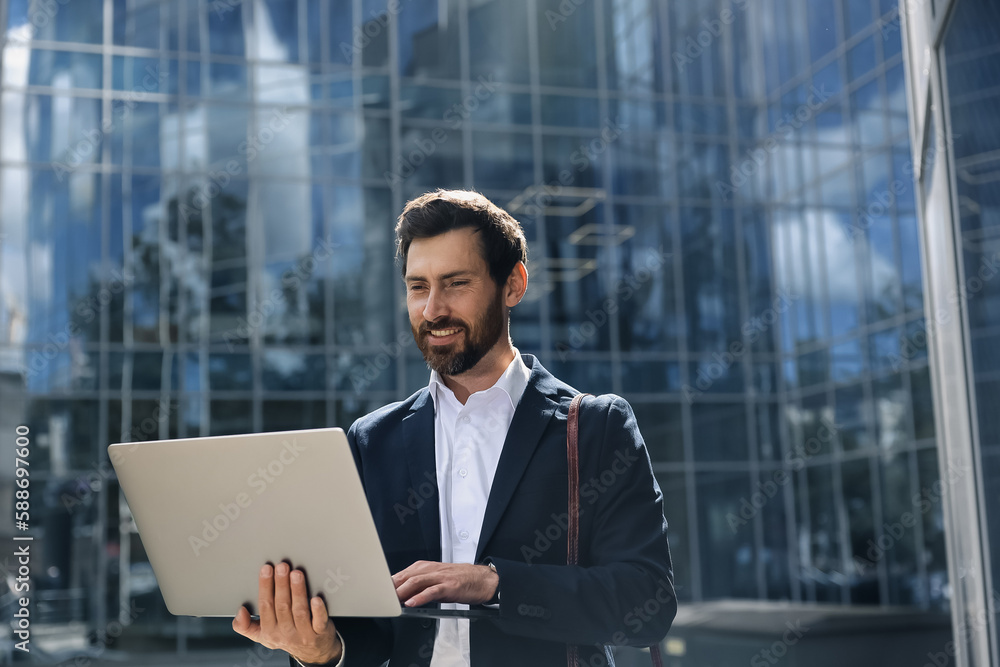 Stylish businessman with a laptop Stylish businessman with a laptop