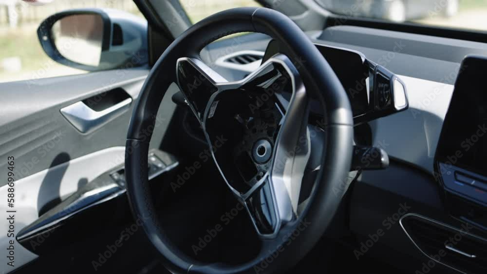 Close-up of the steering wheel of a car after an accident. The driver's airbags deploy. Vehicle interior. Dashboard and steering wheel. Air bag after car crash. Airbag in a car after an accident Close-up of the steering wheel of a car after an accident. The driver's airbags deploy. Vehicle interior. Dashboard and steering wheel. Air bag after car crash. Airbag in a car after an accident